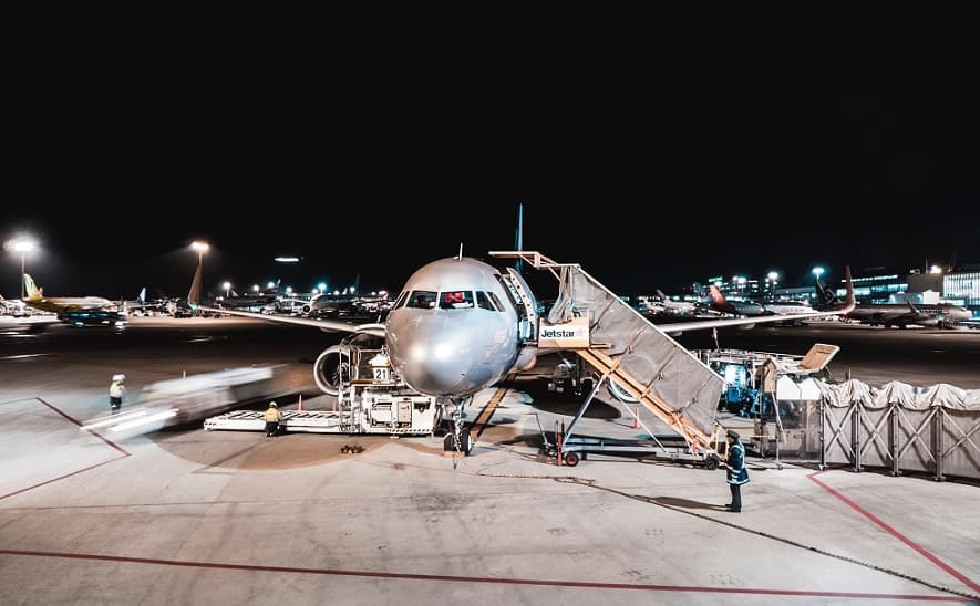 Airline on tarmac at night