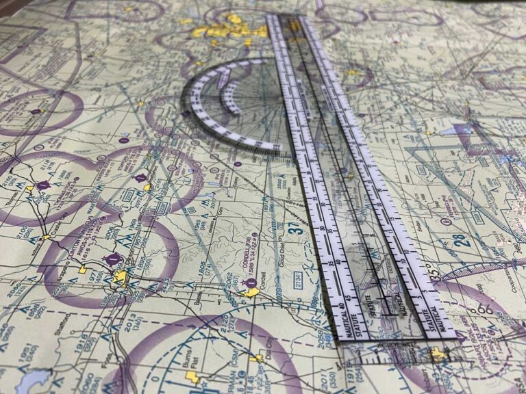 Navigation plotter on a sectional aeronautical chart