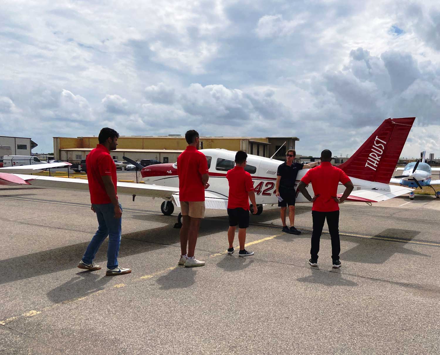 Flight instructor teaching group of Zero Time to Airline students